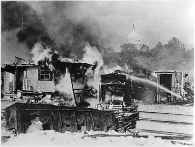 Shacks, put up by the Bonus Army on the Anacostia flats, Washington, DC, burning after the battle with the military, 193 - NARA - 531102 photo