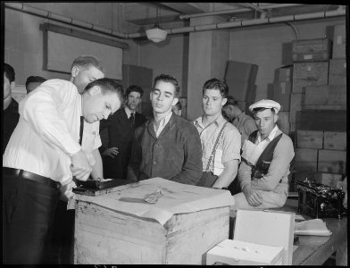 San Francisco, California. Hanging Around. Shipping Day in a Navy enlistment office. These boys are being finger... - NARA - 532263 photo