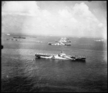 Ships of the fighting fleet in Ulithi Atoll. Foreground to background, USS WASP, USS YORKTOWN, USS HORNET, USS... - NARA - 520666