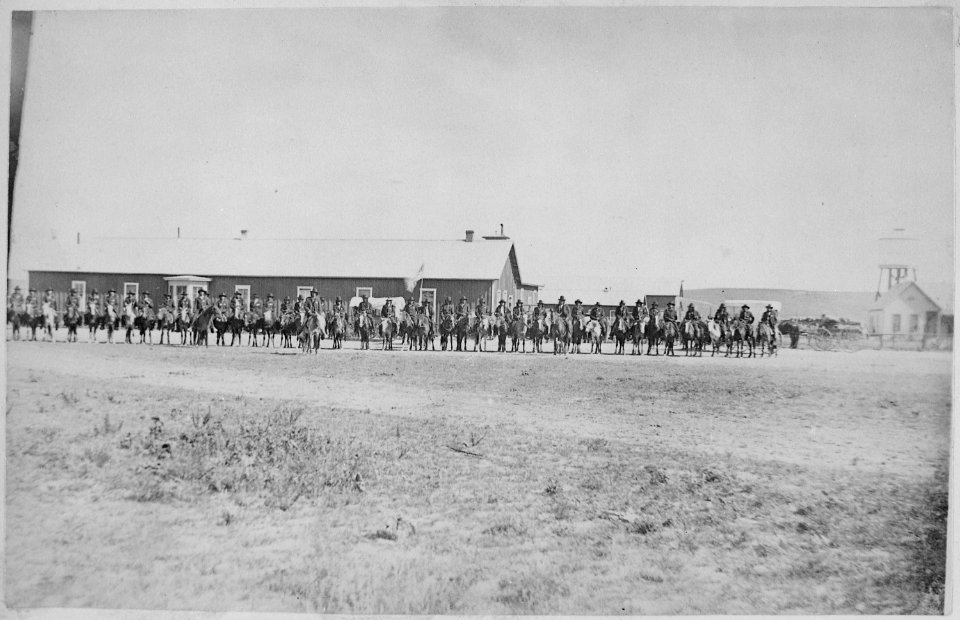 Sioux Indian police lined up on horseback in front of Pine Ridge Agency buildings, Dakota Territory, 08-09-1882 - NARA - 519143