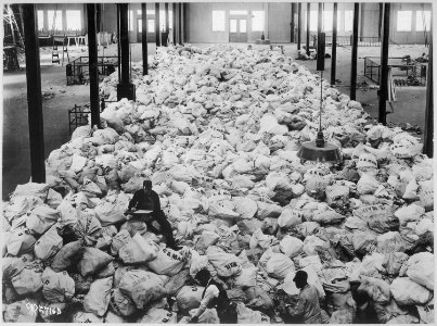 Small portions of the Christmas mail that is being sorted at Pier 86, North River, New York City, for the American... - NARA - 530767 photo