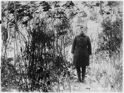 Sergeant Alvin C. York, 328th Infantry, who with aid of 17 men, captured 132 German prisoners, shows hill on which raid - NARA - 530787