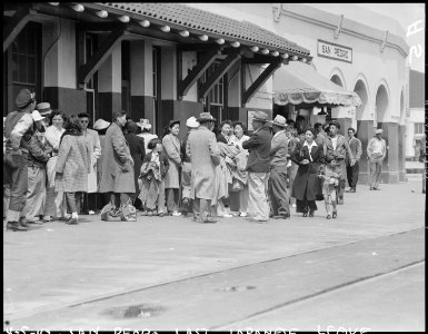 San Pedro, California. Evacuees of Japanese ancestry waiting for the train which will take them to . . . - NARA - 536003