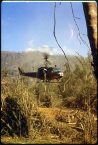 South Vietnam. A UH-1D Medevac helicopter takes off to pick up an injured member of the 101st Airborn Division, near... - NARA - 530627 photo