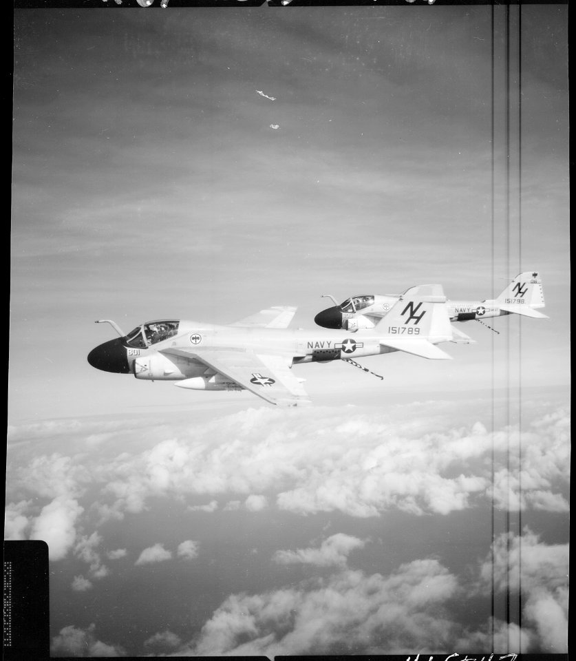 South China Sea....Two Attack Squadron 85, VA-85, A-6A intruder attack aircraft in flight with their tailhooks... - NARA - 558529