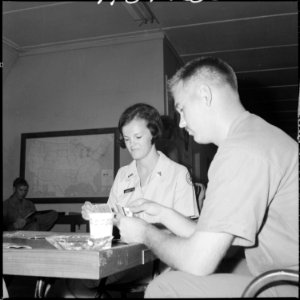 South Vietnam....Loretta Clause plays cards, talks, etc., with Marines of H&S, 1st Marine Division. She is a... - NARA - 532478 photo