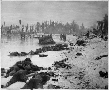 Sprawled bodies on beach of Tarawa, testifying to ferocity of the struggle for this stretch of sand. - NARA - 520625
