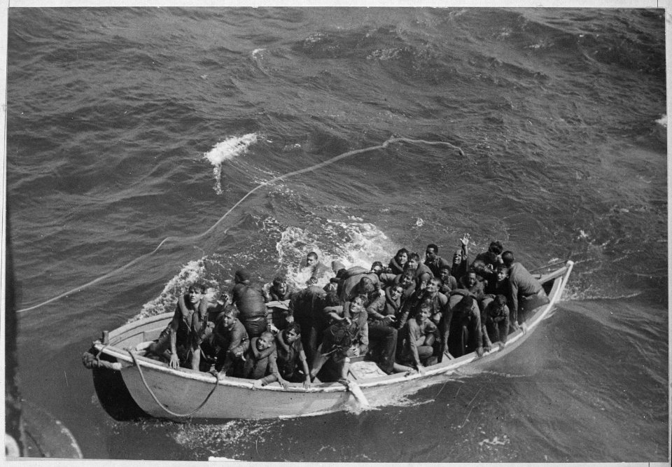 Survivors of USS PRINCETON adrift in life boat at sea as seen from USS CASSIN YOUNG. - NARA - 520660