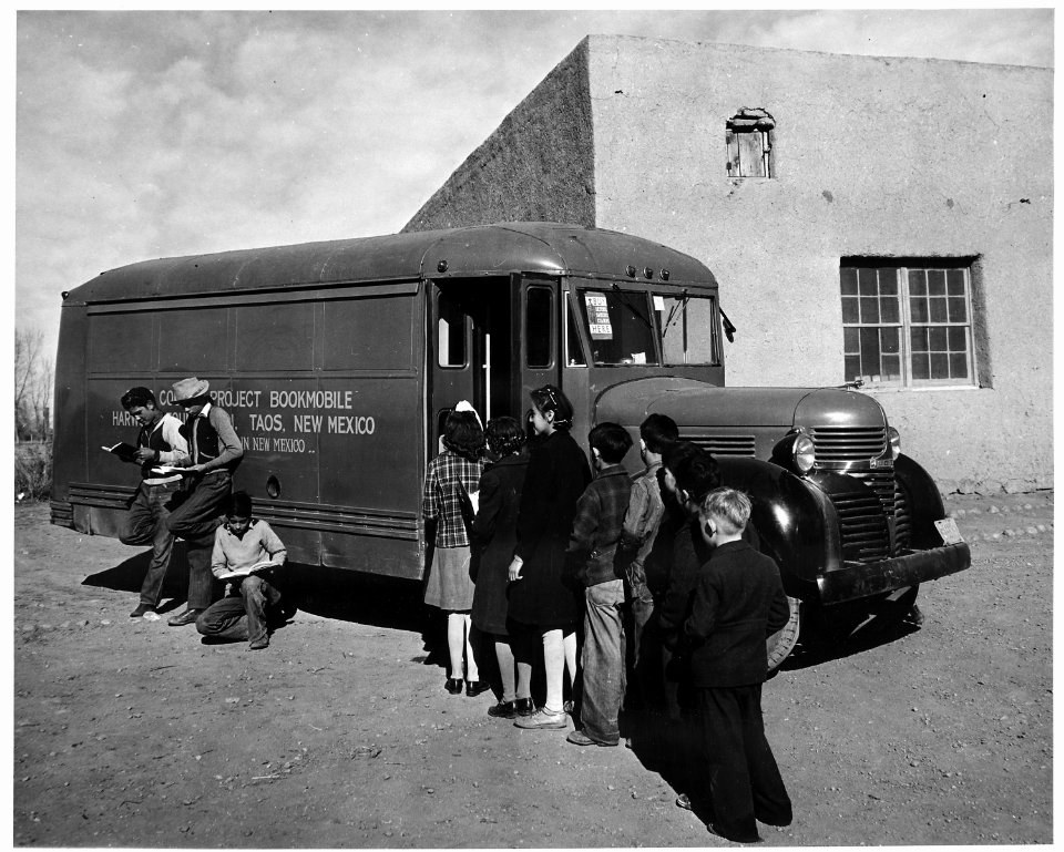 Taos County, New Mexico. Children line up for books when Taos County project bookmobile visits scho . . . - NARA - 521857