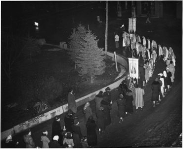 Taos County, New Mexico. Fiesta of Guadalipe, Taos. Following vespers, congregation leaves church, . . . - NARA - 521955