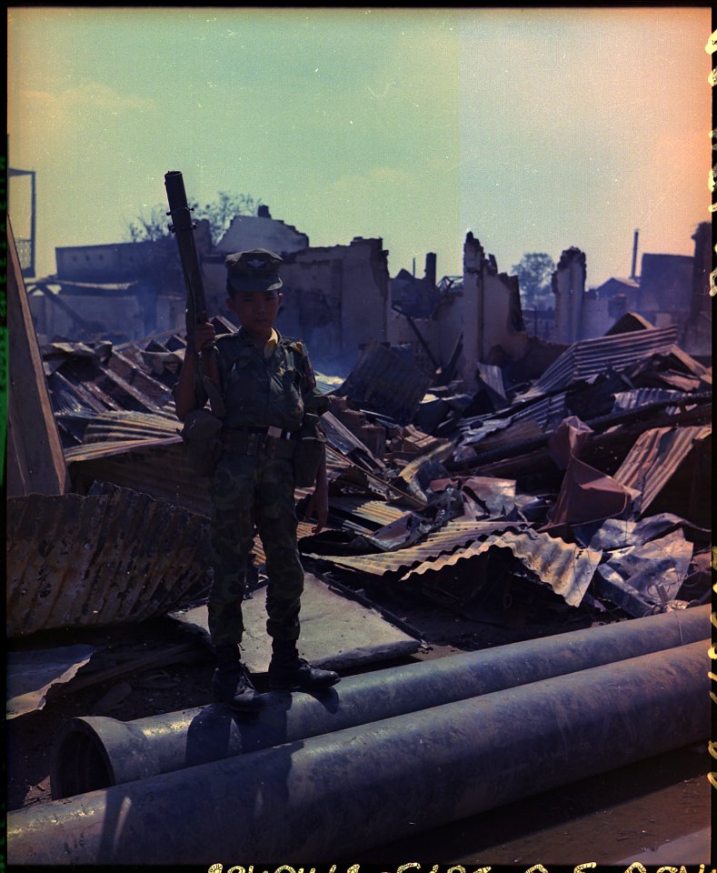 Tan Son Nhut, Vietnam. This twelve year old ARVN Airborne trooper with M-79 grenade launcher accompanied the Airborne... - NARA - 530623