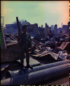 Tan Son Nhut, Vietnam. This twelve year old ARVN Airborne trooper with M-79 grenade launcher accompanied the Airborne... - NARA - 530623