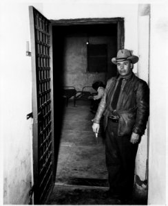 Taos County, New Mexico. Down a short corridor from the sheriff's office is the door of the county . . . - NARA - 521884