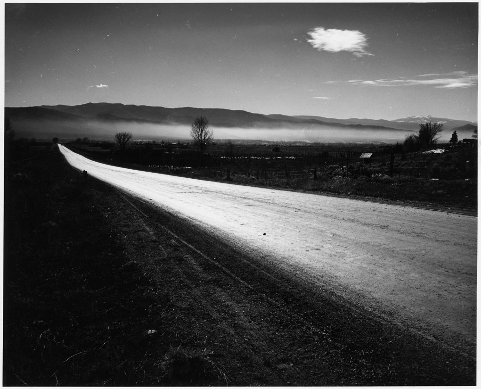 Taos County, New Mexico. Mist in Taos Valley in the morning. Highway into Taos village from the no . . - NARA - 521817