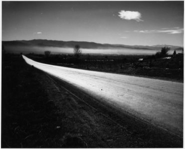 Taos County, New Mexico. Mist in Taos Valley in the morning. Highway into Taos village from the no . . - NARA - 521817