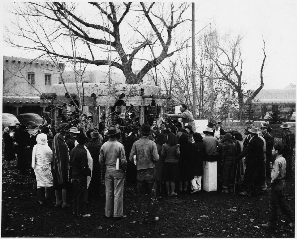 Taos County, New Mexico. Merchandise is auctioned off in Taos plaza for coupons given with purchase . . . - NARA - 521849