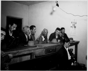 Taos County, New Mexico. Spectators watch as Justice of the Peace hears a case. - NARA - 522001