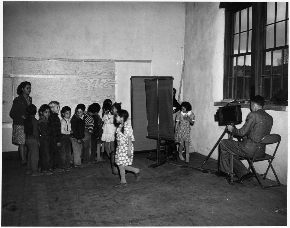 Taos County, New Mexico. Teachers cooperate with itinerant photographer at Questa school. Photogra . . . - NARA - 521869