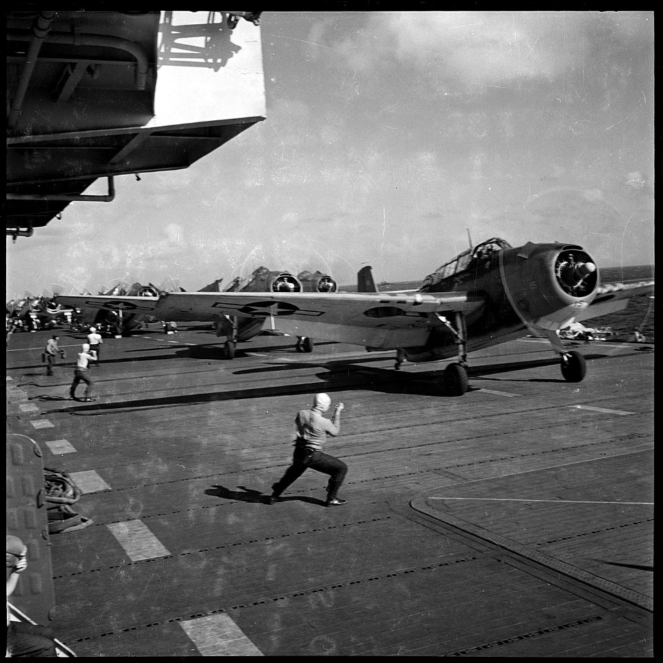TBF's aboard USS Monterey (CVL-26) leaving flight deck for a bombing mission over Tinian Island, nearest Japanese... - NARA - 520803
