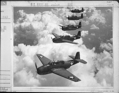 TBF's flying in perfect echelon formation over Norfolk, VA - NARA - 520770