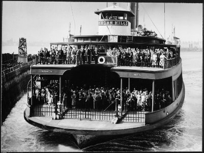 The ferryboat Dongan Hills, filled with commuters, about to dock at a New York City pier, ca. 1945 - NARA - 541821 photo