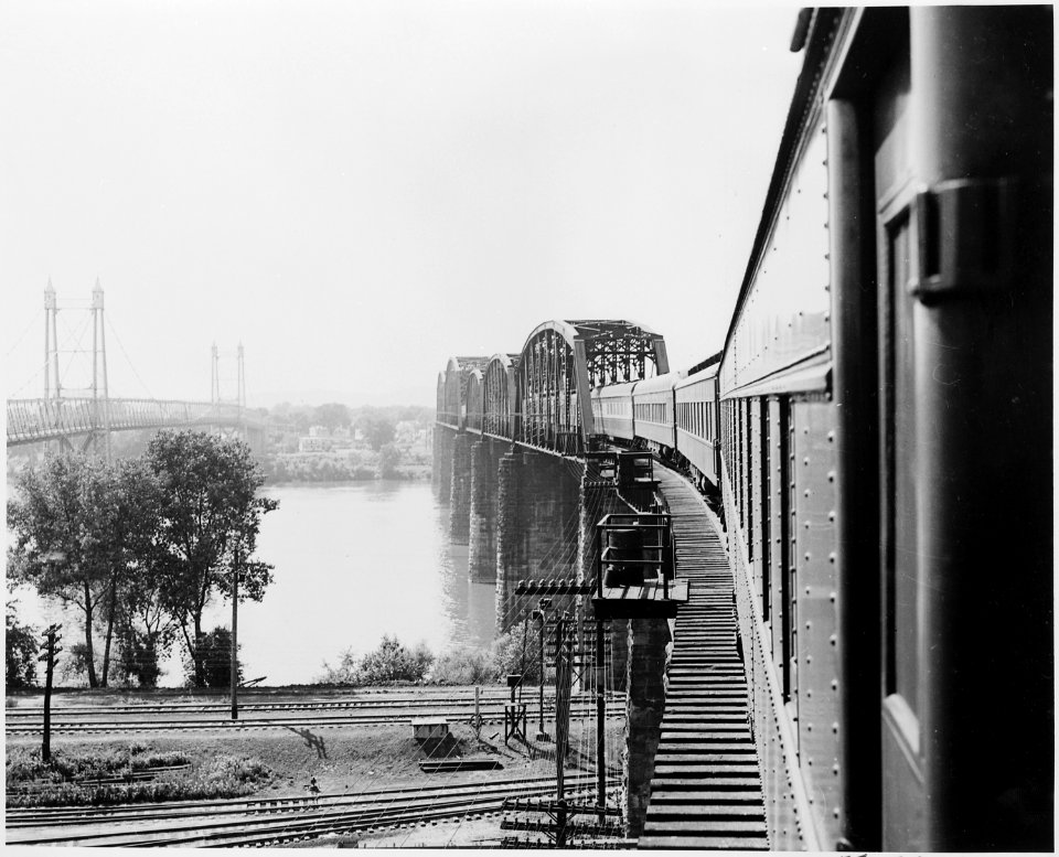 The presidential train crossing a bridge on its way to or leaving Bolivar, Missouri. President Harry S. Truman... - NARA - 199878