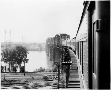 The presidential train crossing a bridge on its way to or leaving Bolivar, Missouri. President Harry S. Truman... - NARA - 199878