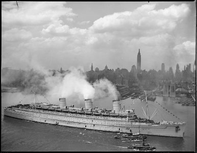The famous British liner, QUEEN MARY, arrives in New York Harbor, June 20, 1945, with thousands of U.S. troops from... - NARA - 521011