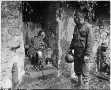 This dead German soldier was one of the last stand defenders of German-held Cherbourg. Captain Earl Topley, who led... - NARA - 531214