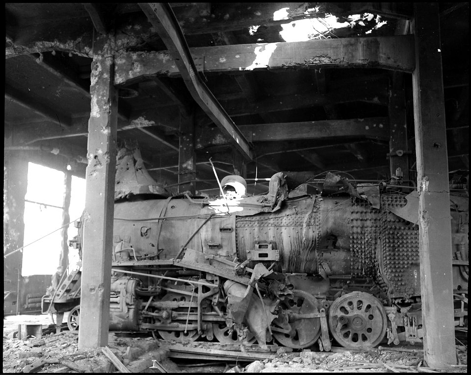 This photograph, taken in Pyongyang, N.W. marshalling yards, Korea, illustrates the aftermath of a bombing raid by... - NARA - 542285