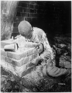This victim of Nazi inhumanity still rests in the position in which he died, attempting to rise and escape his... - NARA - 531265