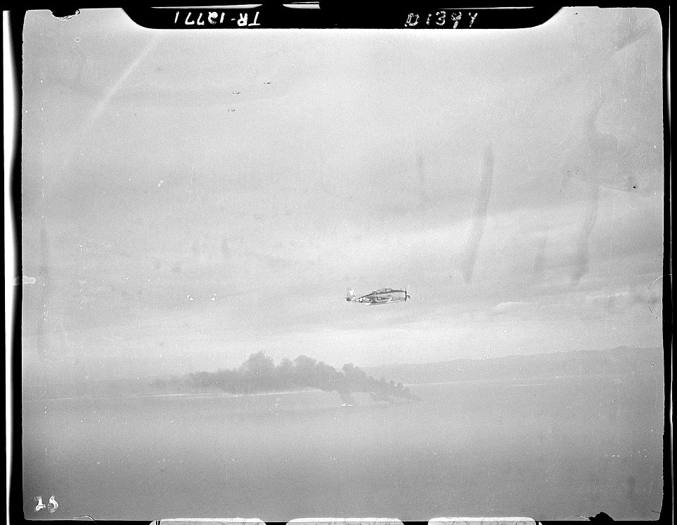 Three Japanese oilers burning in Camranh Bay, Indochina. TBM's from the USS Hornet (CV-12) which delivered the fatal... - NARA - 520865