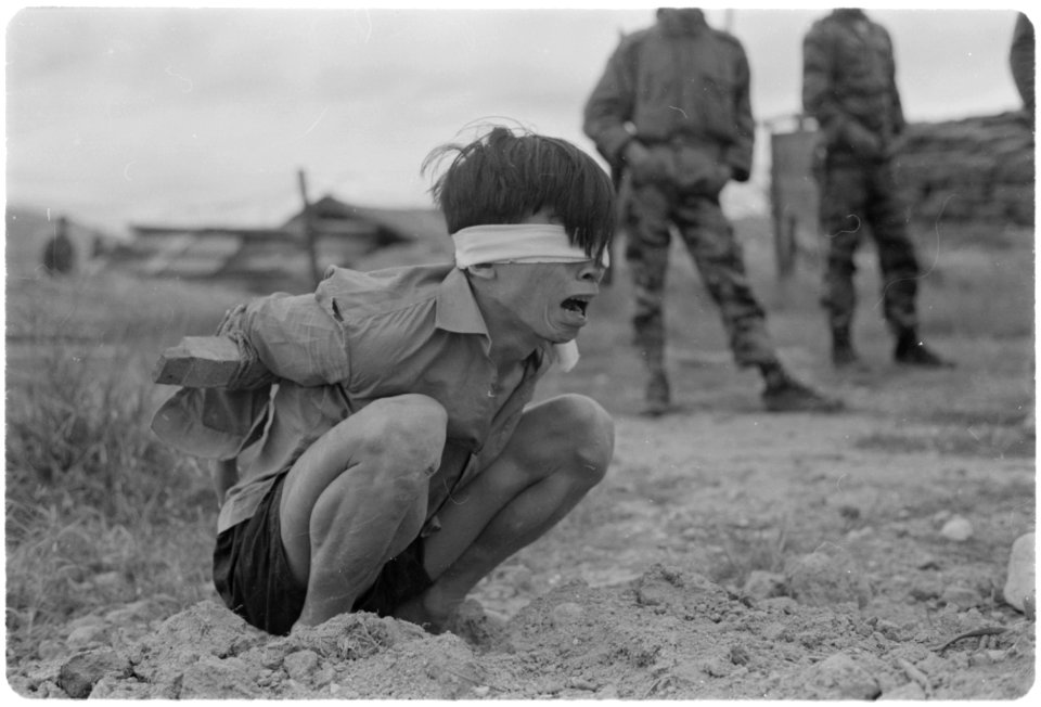 Thuong Duc, Vietnam....A Viet Cong prisoner awaits interrogation at the A-109 Special Forces Detachment in Thuong... - NARA - 531447