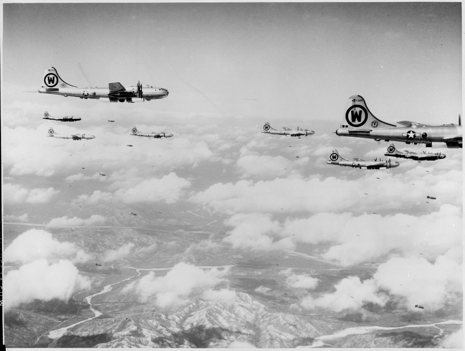 This formation of B-29s is shown flying over enemy territory in Korea. Over twenty-four million pounds of bombs have... - NARA - 542198