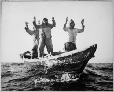 Three Korean Communists in a fishing boat are captured by the USS Manchester off the coast of Korea. - NARA - 520792 photo