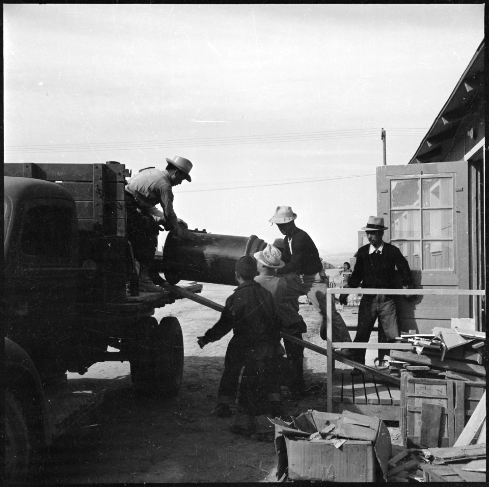 Topaz, Utah. A crew delivering United States Army Number 1 Space Heaters to a resident barracks at . . . - NARA - 538714