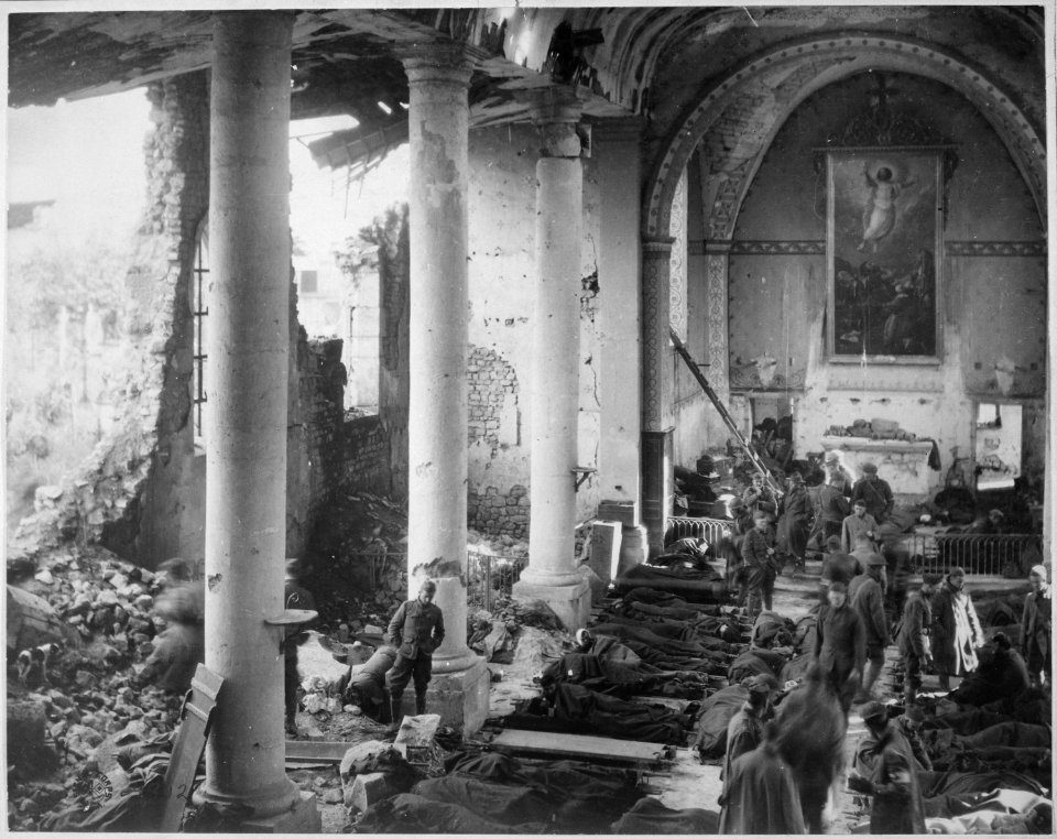 This shattered church in the ruins of Neuvilly furnished a temporary shelter for American wounded being treated by... - NARA - 530762