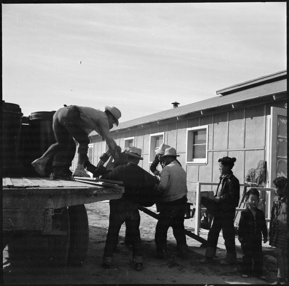 Topaz, Utah. A crew delivering United States Army Number 1 Space Heaters to a resident barracks at . . . - NARA - 538716