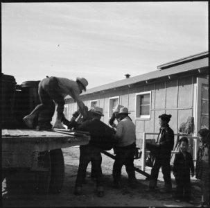 Topaz, Utah. A crew delivering United States Army Number 1 Space Heaters to a resident barracks at . . . - NARA - 538716