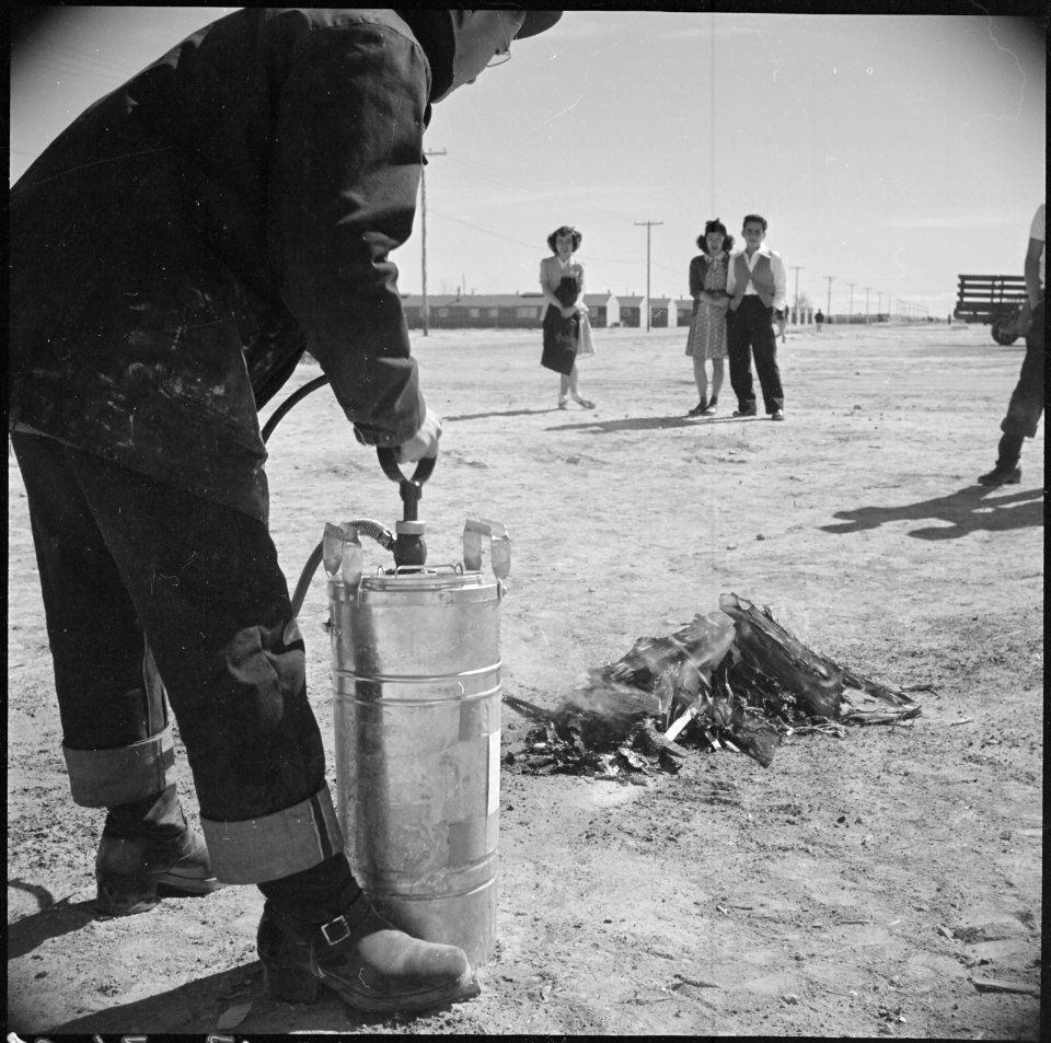 Topaz, Utah. A demonstration fire fighting with a stirrup pump is put on by evacuee member of the f . . . - NARA - 537015