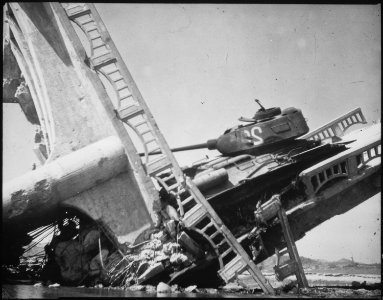 The wreckage of a bridge and North Korean Communist tank south of Suwon, Korea. The tank was caught on a bridge and... - NARA - 530633