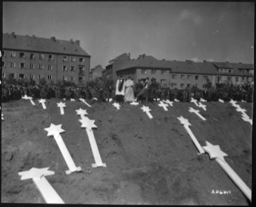 These markers are for the graves of 80 victims of the Nazis found in Ludwigslust. The entire population of Schwerin... - NARA - 531295