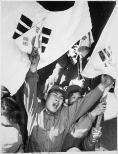 This anti-Communist North Korean just released from a prisoner of war camp is serving as a kind of cheerleader for... - NARA - 541966 photo