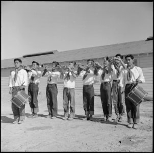 Topaz, Utah. A drum and bugle corp, formerly a boy scout unit in Los Angeles, performs at the dedic . . . - NARA - 538707