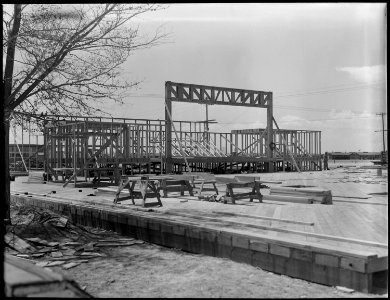 Topaz, Utah. First truss erected in construction of new high school at Topaz. - NARA - 537259 photo