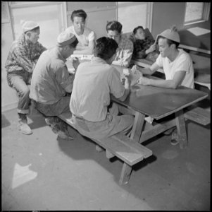 Topaz, Utah. Members of the fire department spend their leisure time by a friendly game of cards. - NARA - 537012