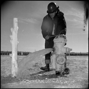 Topaz, Utah. Mike Yoshimine, an evacuee member of the Fire Derpartment, makes a routine check of a . . . - NARA - 536994