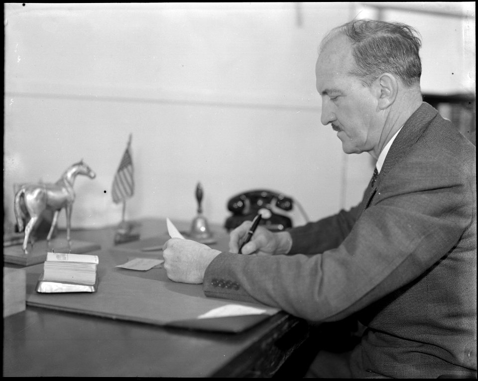 Topaz, Utah. Charles E. Ernst, Project Director, at his desk in the Administrative building at the . . . - NARA - 538669