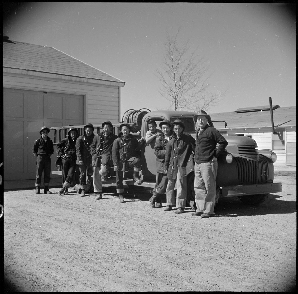 Topaz, Utah. Evacuee firemen are shown posed beside their fire truck. Excellent work by this highl . . . - NARA - 537010