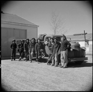 Topaz, Utah. Evacuee firemen are shown posed beside their fire truck. Excellent work by this highl . . . - NARA - 537010 photo